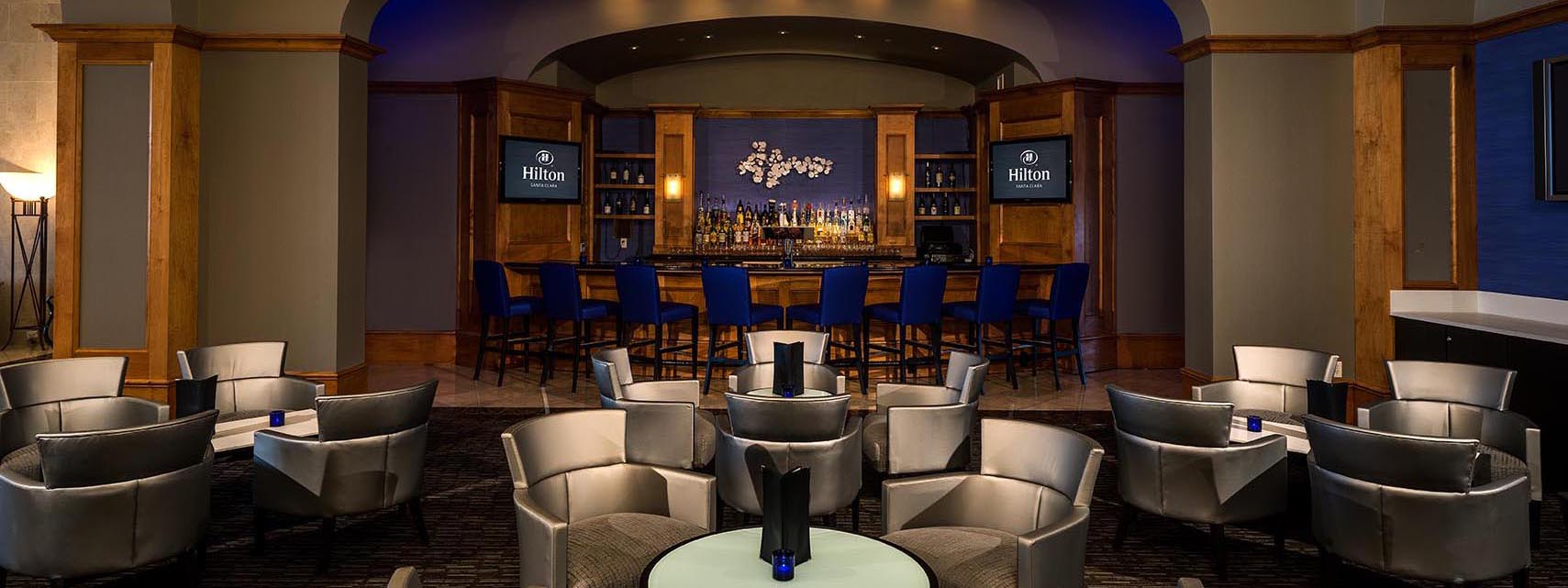 Elegant La Fontana Lounge bar area at Hilton Santa Clara with plush seating and full-service bar